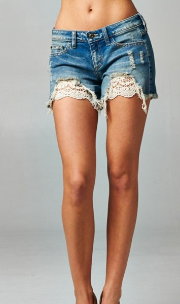 The Kimber Shorts are distressed shorts with crochet detail. 